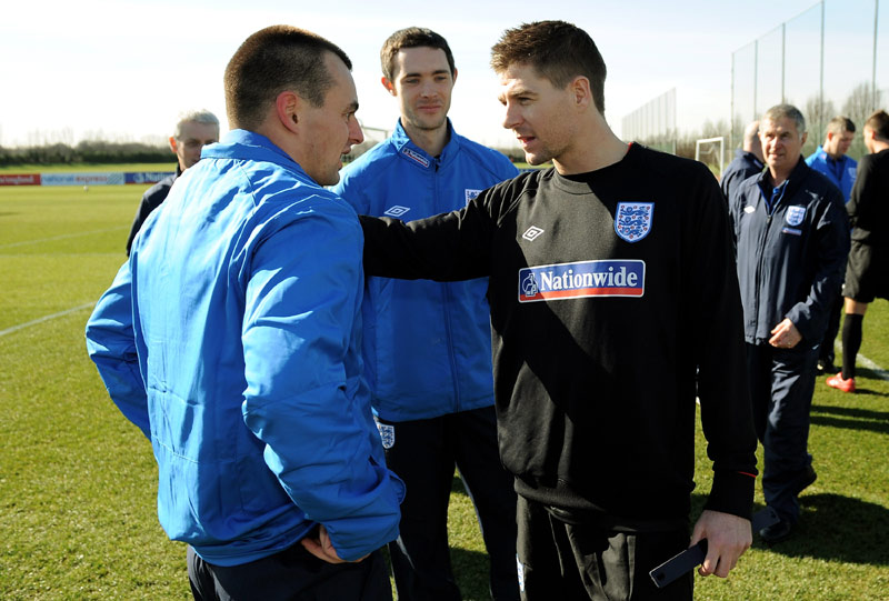 Craig Lundberg (left) meets Steven Gerrard at London Colney ahead of England's friendly against Egypt.